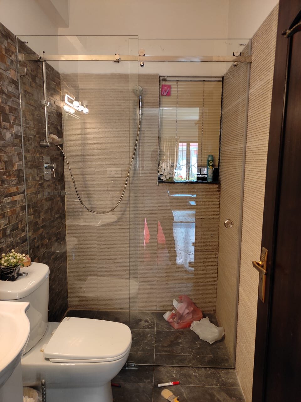 Toughened glass shower enclosure
